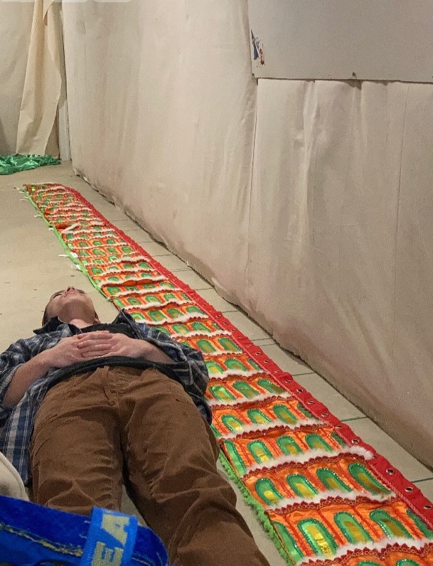 me laying next to the dragon body