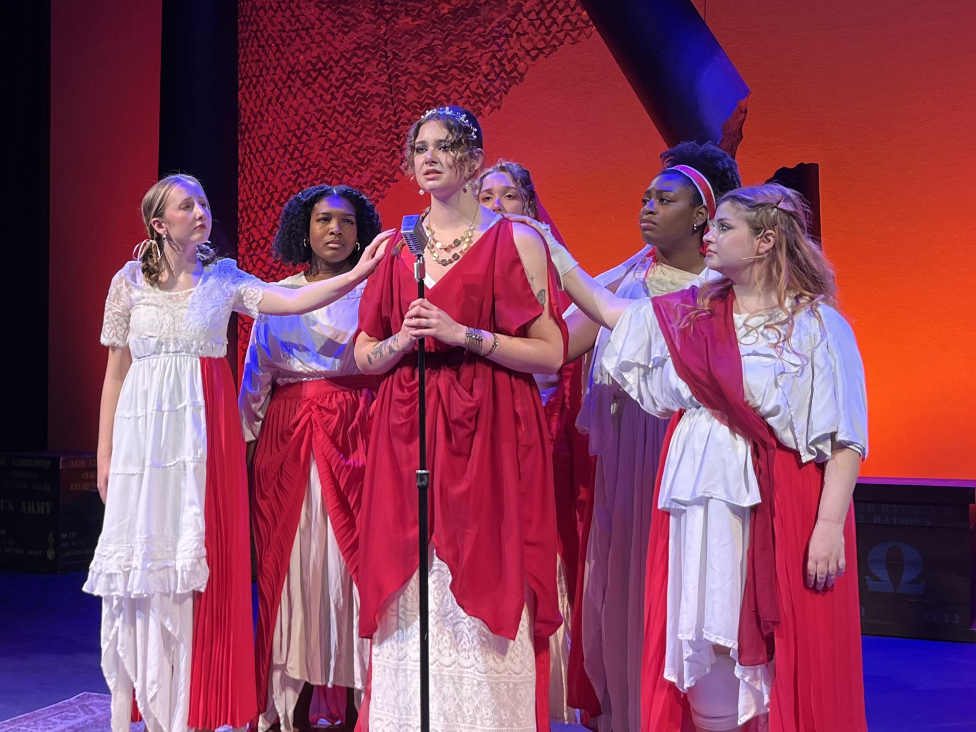 Women of Troy surround Helen