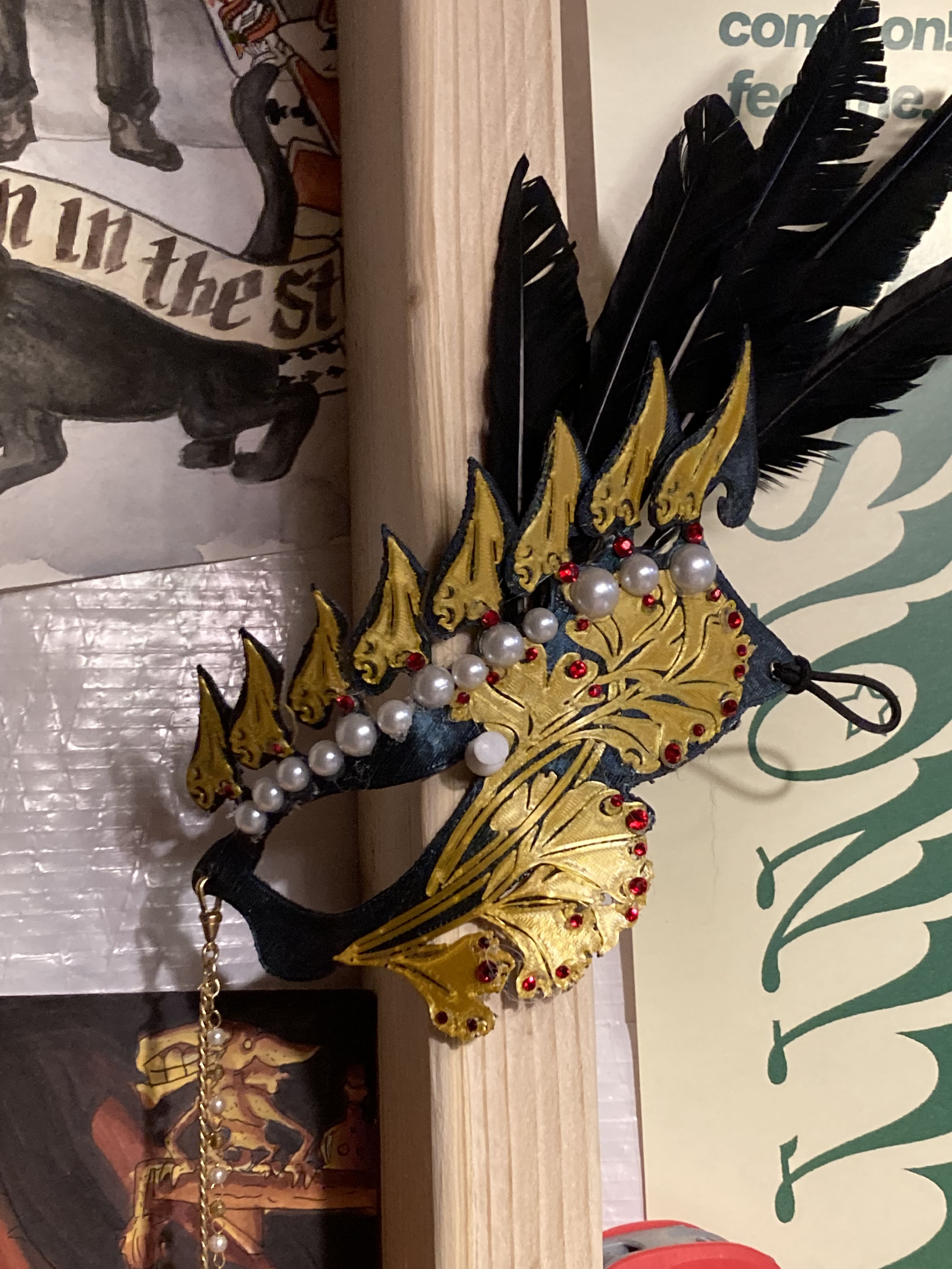 picture of 3d printed masquerade mask embellishd with feathers and rhinestones