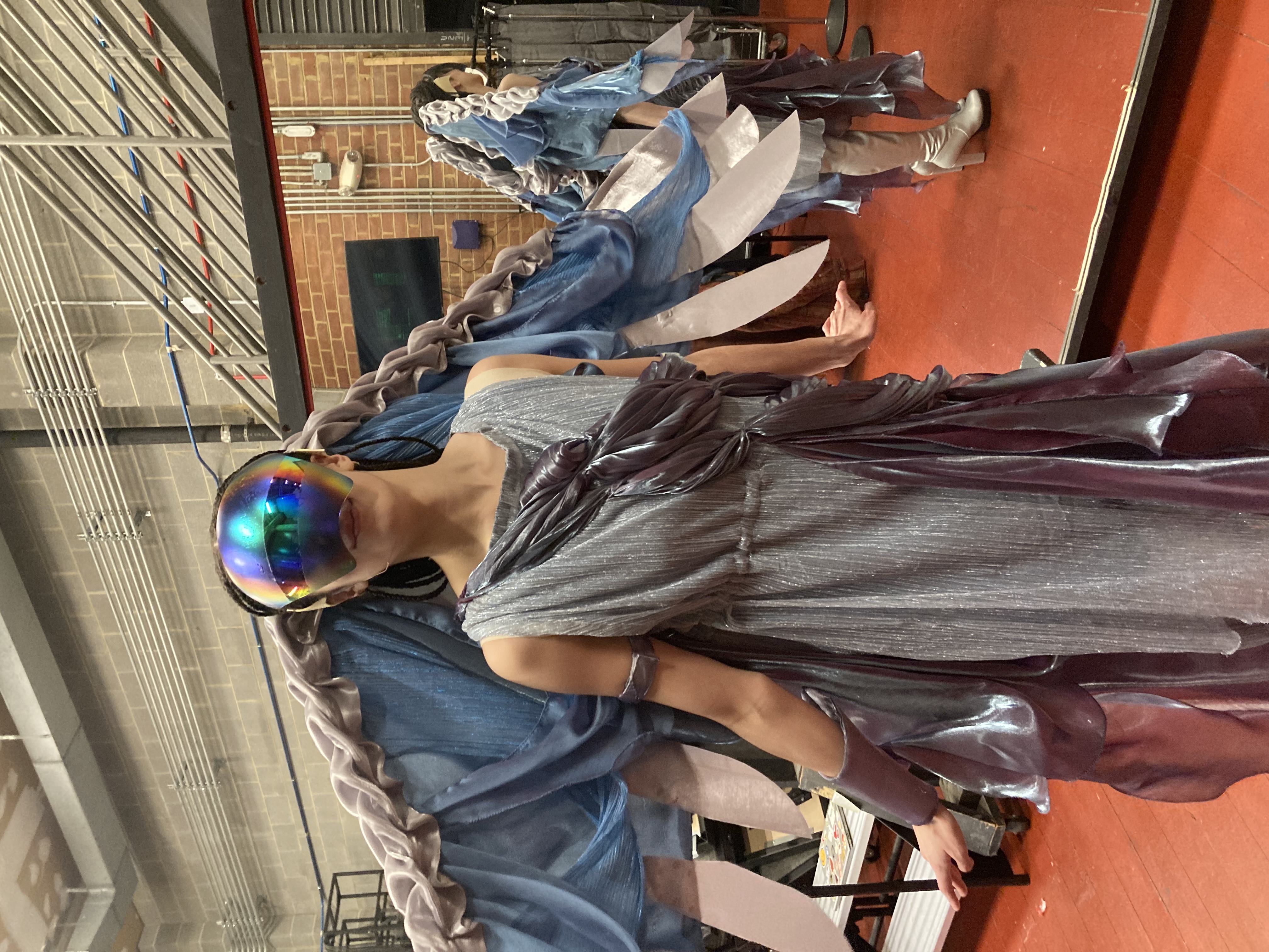 Ariel backstage, wearing visor and wings